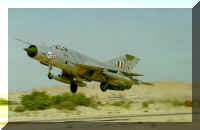 Mig-21M takes off from a desert air base